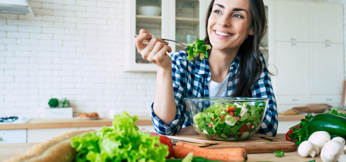 woman eating salad