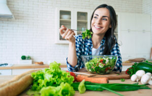 woman eating salad